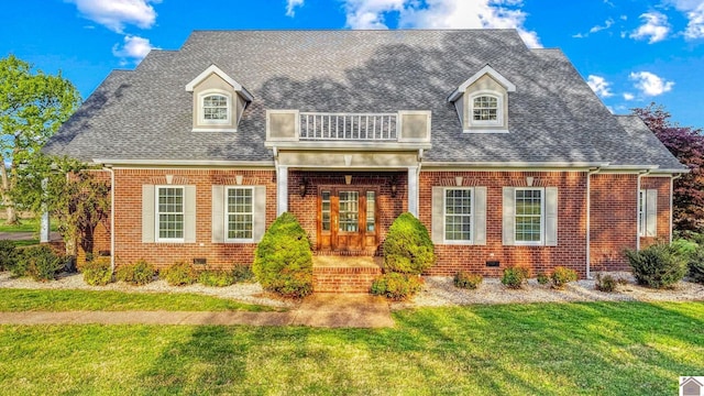 730 Rob Mason Rd, Murray, KY 42071 - view of front of home with brick siding, a front yard, french doors, and a shingled roof