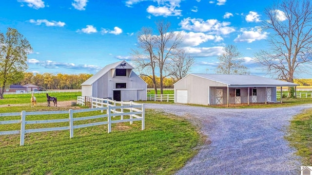 730 Rob Mason Rd, Murray, KY 42071 - view of front of home with an outdoor structure, a barn, driveway, a detached garage, and an exterior structure