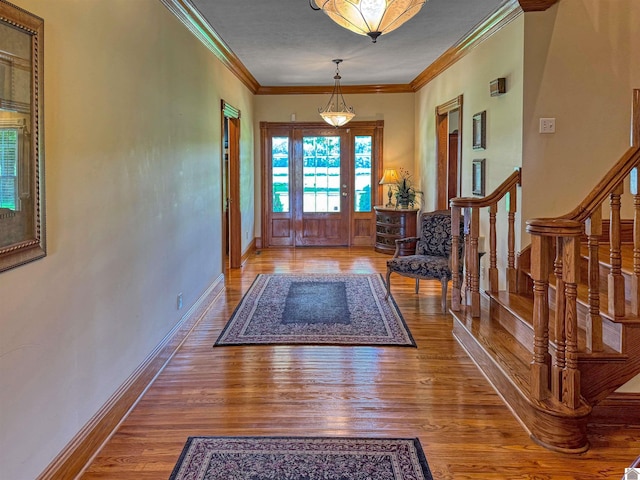 730 Rob Mason Rd, Murray, KY 42071 - foyer featuring wood finished floors, baseboards, crown molding, and stairway