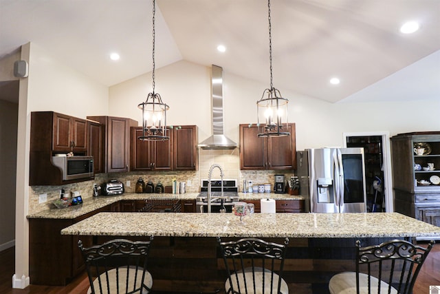 1300 Rocky Rd, Fancy Farm, KY 42039 - kitchen featuring stainless steel appliances, wall chimney exhaust hood, lofted ceiling, a kitchen breakfast bar, and dark wood-style flooring