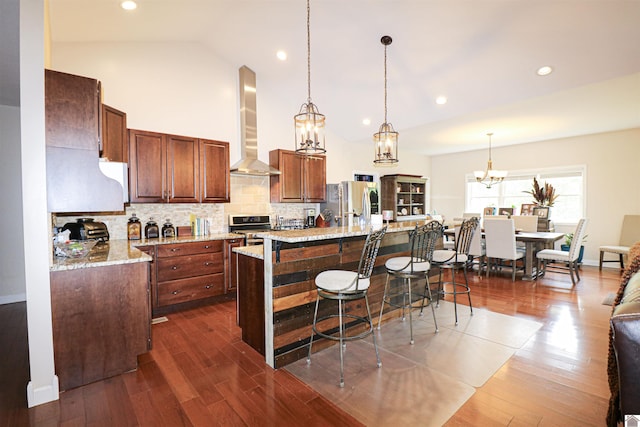 1300 Rocky Rd, Fancy Farm, KY 42039 - kitchen featuring wall chimney range hood, a chandelier, a kitchen breakfast bar, backsplash, and a center island with sink