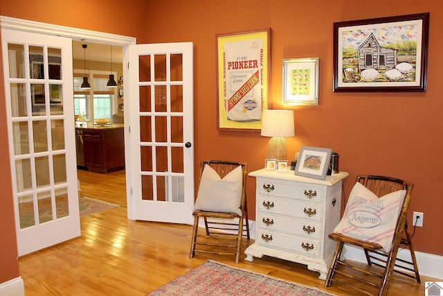 494 Beat Farmer Rd, New Concord, KY 42076 - sitting room with french doors and wood finished floors
