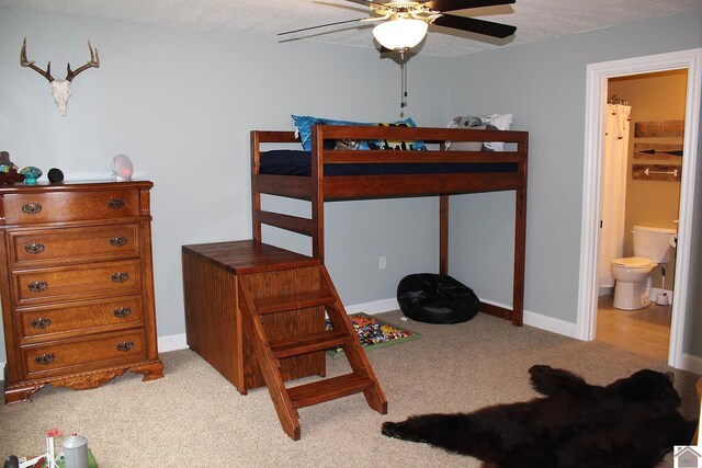 494 Beat Farmer Rd, New Concord, KY 42076 - carpeted bedroom featuring ensuite bathroom and baseboards