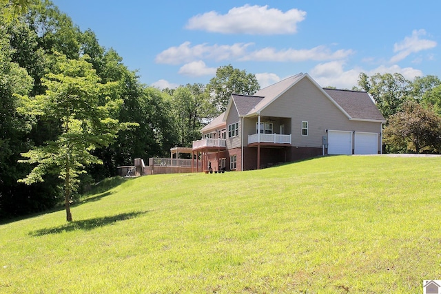 494 Beat Farmer Rd, New Concord, KY 42076 - view of property exterior featuring a lawn, a garage, and a balcony