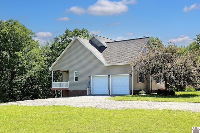 494 Beat Farmer Rd, New Concord, KY 42076 - view of home's exterior featuring a yard, gravel driveway, an attached garage, and roof with shingles