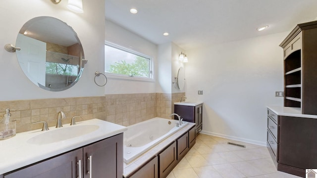 bathroom with a stall shower, tile patterned floors, a whirlpool tub, and two vanities
