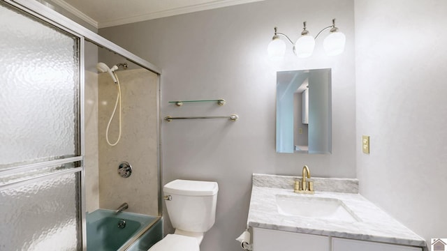 full bathroom with crown molding, vanity, toilet, and combined bath / shower with glass door