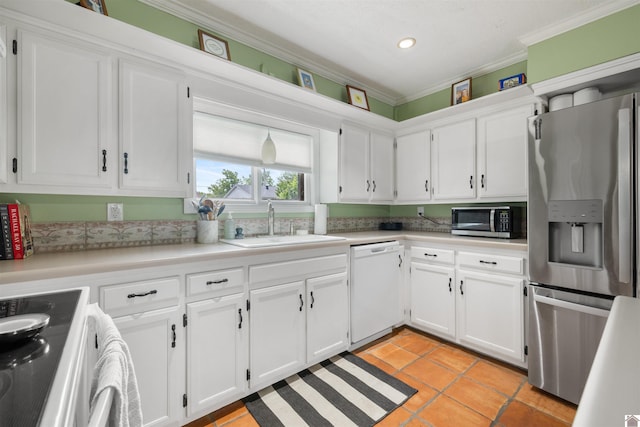 521 Whitnell Ave, Murray, KY 42071 - kitchen featuring stainless steel appliances, crown molding, a sink, light countertops, and white cabinetry