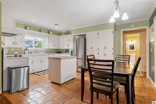 521 Whitnell Ave, Murray, KY 42071 - kitchen featuring appliances with stainless steel finishes, under cabinet range hood, a sink, ornamental molding, and light countertops