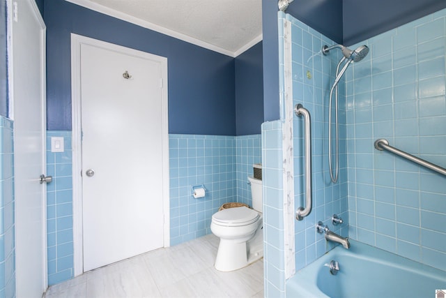 521 Whitnell Ave, Murray, KY 42071 - bathroom featuring tile walls, toilet, tile patterned flooring,  shower combination, and wainscoting