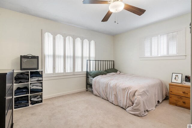 521 Whitnell Ave, Murray, KY 42071 - carpeted bedroom featuring multiple windows, ceiling fan, and baseboards