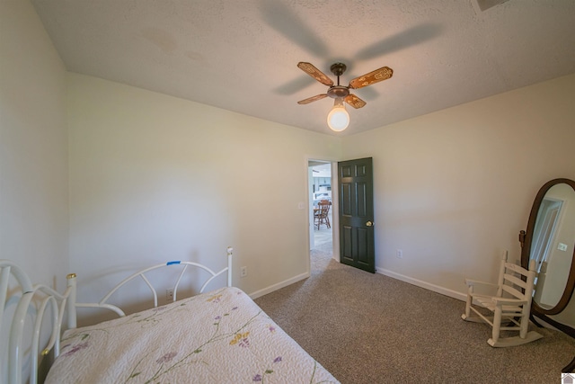 bedroom featuring carpet, baseboards, and a ceiling fan