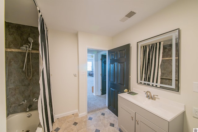 bathroom featuring shower / tub combo, vanity, and baseboards