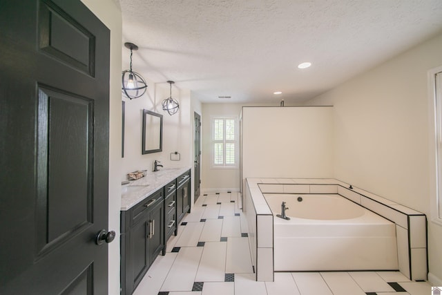 full bathroom with a garden tub, a textured ceiling, walk in shower, double vanity, and tile patterned floors