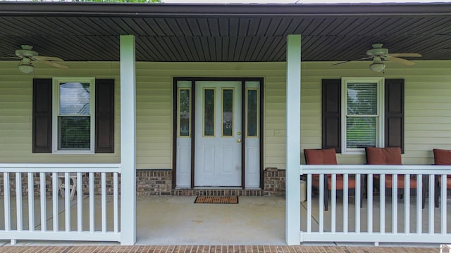 property entrance featuring ceiling fan and a porch