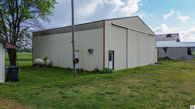 view of pole building with a lawn