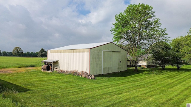view of pole building with a yard