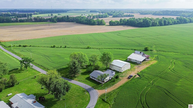 aerial view of sparsely populated area featuring large plots for crops and a pastoral area