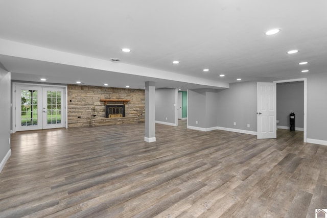 890 Ridge Rd, Gilbertsville, KY 42044 - below grade area with baseboards, recessed lighting, wood finished floors, and a fireplace
