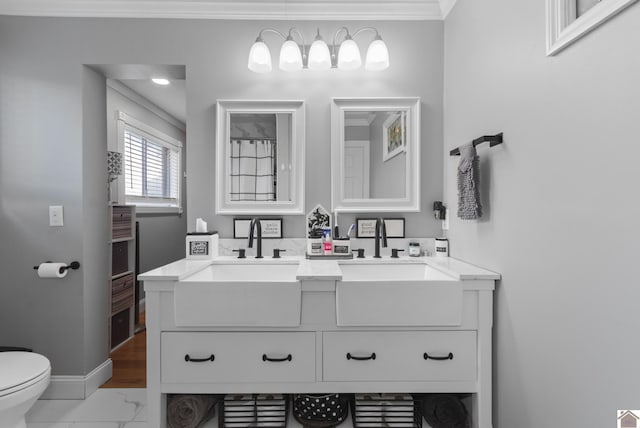 890 Ridge Rd, Gilbertsville, KY 42044 - full bath with ornamental molding, baseboards, toilet, double vanity, and marble look tiles
