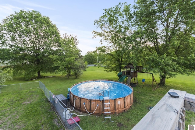 890 Ridge Rd, Gilbertsville, KY 42044 - view of swimming pool featuring a jacuzzi, a playground, and view of scattered trees