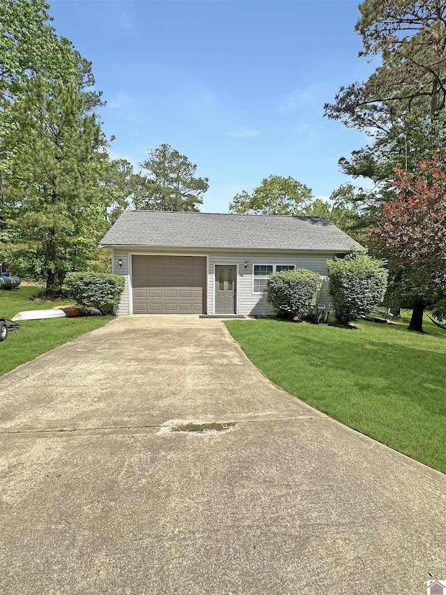 478 Lovers Ln, Benton, KY 42025 - view of front of house with concrete driveway, a front lawn, and an attached garage