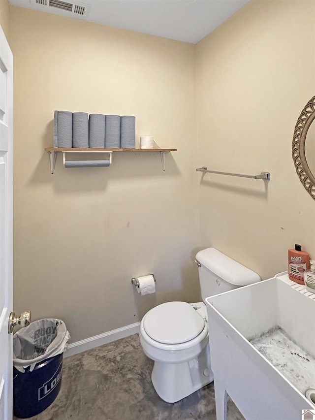 478 Lovers Ln, Benton, KY 42025 - half bath featuring toilet, baseboards, and a sink