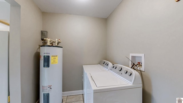 509 S 6th St, Murray, KY 42071 - laundry room featuring water heater, separate washer and dryer, light tile patterned floors, and baseboards