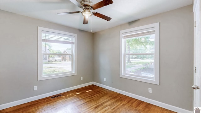 509 S 6th St, Murray, KY 42071 - spare room with healthy amount of natural light, baseboards, wood finished floors, and ceiling fan