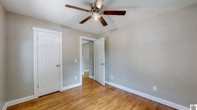 509 S 6th St, Murray, KY 42071 - unfurnished bedroom with baseboards, light wood-type flooring, and ceiling fan