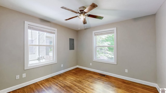 509 S 6th St, Murray, KY 42071 - spare room with baseboards, wood finished floors, ceiling fan, and electric panel