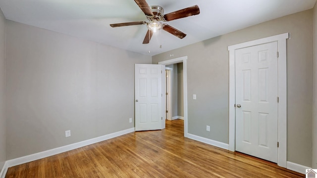 509 S 6th St, Murray, KY 42071 - unfurnished bedroom featuring baseboards, light wood-type flooring, and a ceiling fan