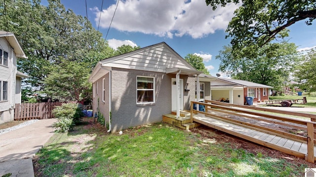 509 S 6th St, Murray, KY 42071 - view of front facade with brick siding and fence