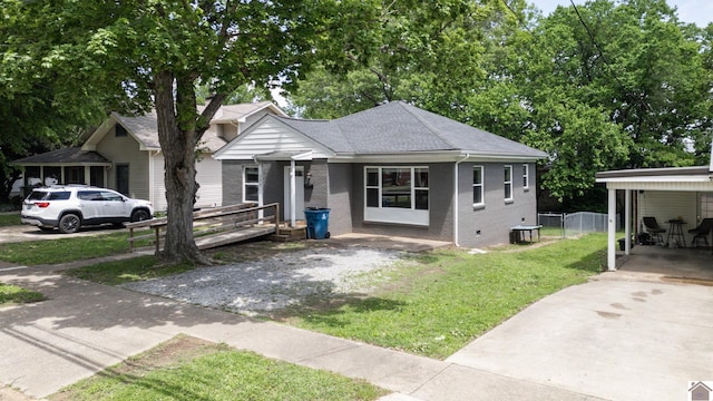 509 S 6th St, Murray, KY 42071 - view of front of home with driveway, brick siding, and a carport