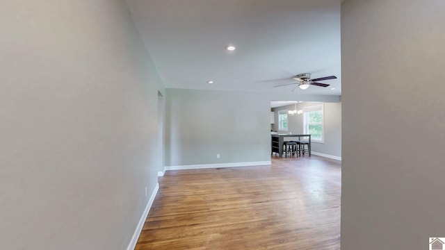 509 S 6th St, Murray, KY 42071 - spare room featuring ceiling fan, baseboards, light wood finished floors, a chandelier, and recessed lighting