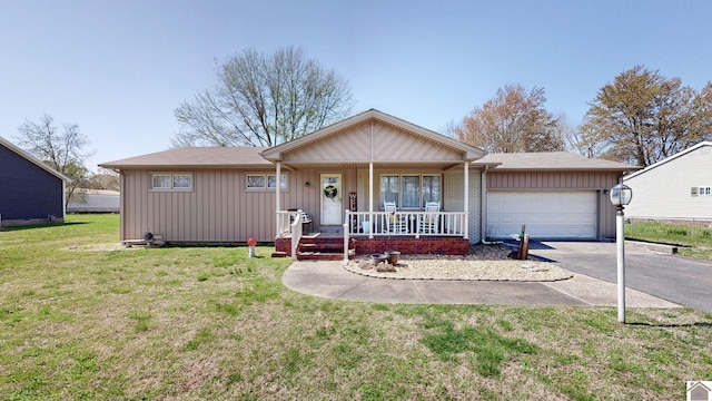 111 Honeysuckle Ln, Murray, KY 42071 - ranch-style house featuring a porch, driveway, a garage, board and batten siding, and a front yard