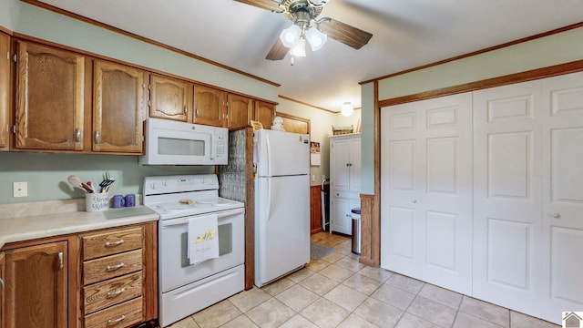 111 Honeysuckle Ln, Murray, KY 42071 - kitchen featuring white appliances, light countertops, ceiling fan, brown cabinets, and light tile patterned floors
