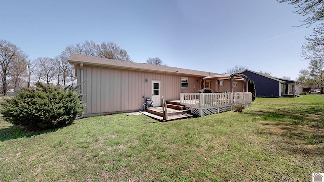 111 Honeysuckle Ln, Murray, KY 42071 - rear view of property featuring board and batten siding, a wooden deck, and a lawn