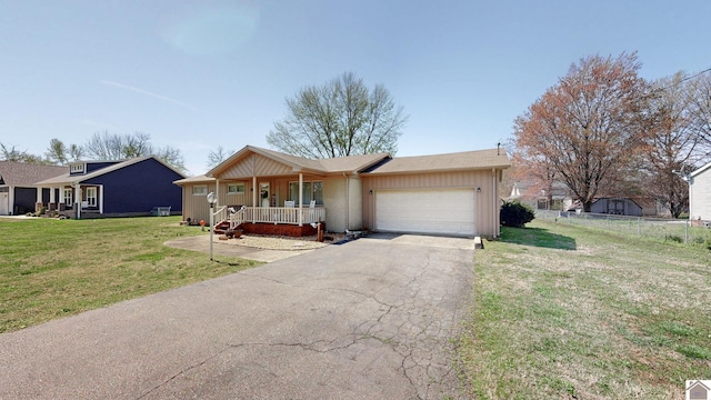 111 Honeysuckle Ln, Murray, KY 42071 - ranch-style home featuring covered porch, an attached garage, asphalt driveway, and board and batten siding