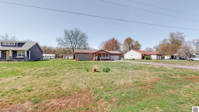 111 Honeysuckle Ln, Murray, KY 42071 - view of front facade with driveway, a front yard, and a garage