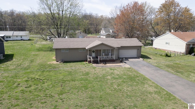 111 Honeysuckle Ln, Murray, KY 42071 - view of front of home with a porch, a garage, driveway, and a front yard