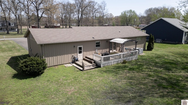 111 Honeysuckle Ln, Murray, KY 42071 - back of house featuring a deck, a lawn, a shingled roof, and cooling unit