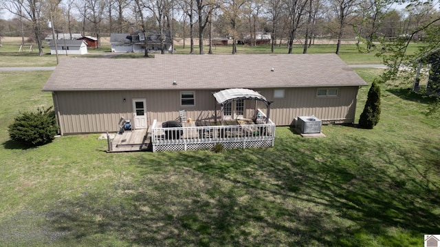 111 Honeysuckle Ln, Murray, KY 42071 - rear view of house with a wooden deck, a yard, and central AC unit