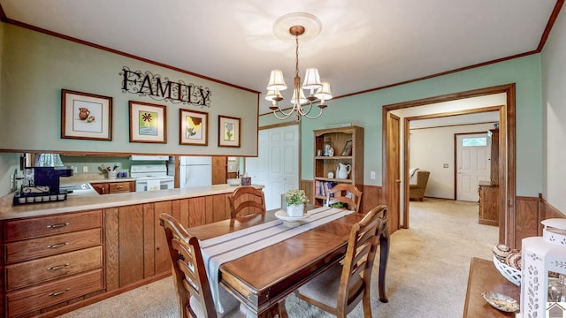 111 Honeysuckle Ln, Murray, KY 42071 - dining area featuring light carpet, a wainscoted wall, a chandelier, and ornamental molding