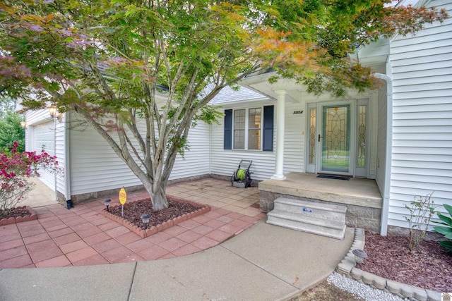 5904 Moors Camp Hwy, Gilbertsville, KY 42044 - view of patio / terrace with a porch and a garage