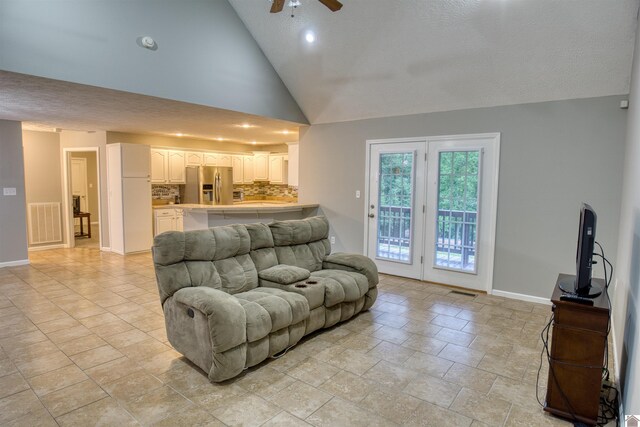 5904 Moors Camp Hwy, Gilbertsville, KY 42044 - living area with ceiling fan, baseboards, vaulted ceiling, light stone finish flooring, and recessed lighting