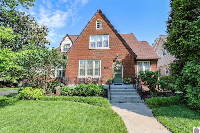 1931 Jefferson St, Paducah, KY 42001 - english style home with brick siding and a front yard