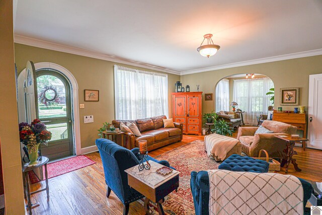 1931 Jefferson St, Paducah, KY 42001 - living room with arched walkways, wood-type flooring, crown molding, and baseboards