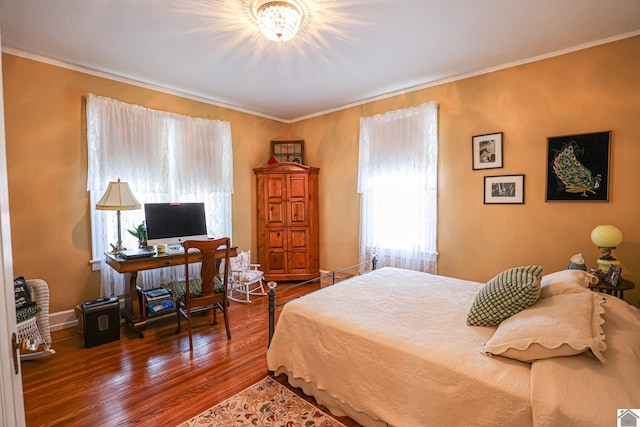 1931 Jefferson St, Paducah, KY 42001 - bedroom featuring multiple windows, wood finished floors, and crown molding