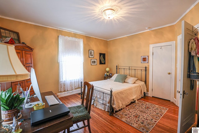 1931 Jefferson St, Paducah, KY 42001 - bedroom featuring wood finished floors, crown molding, and baseboards